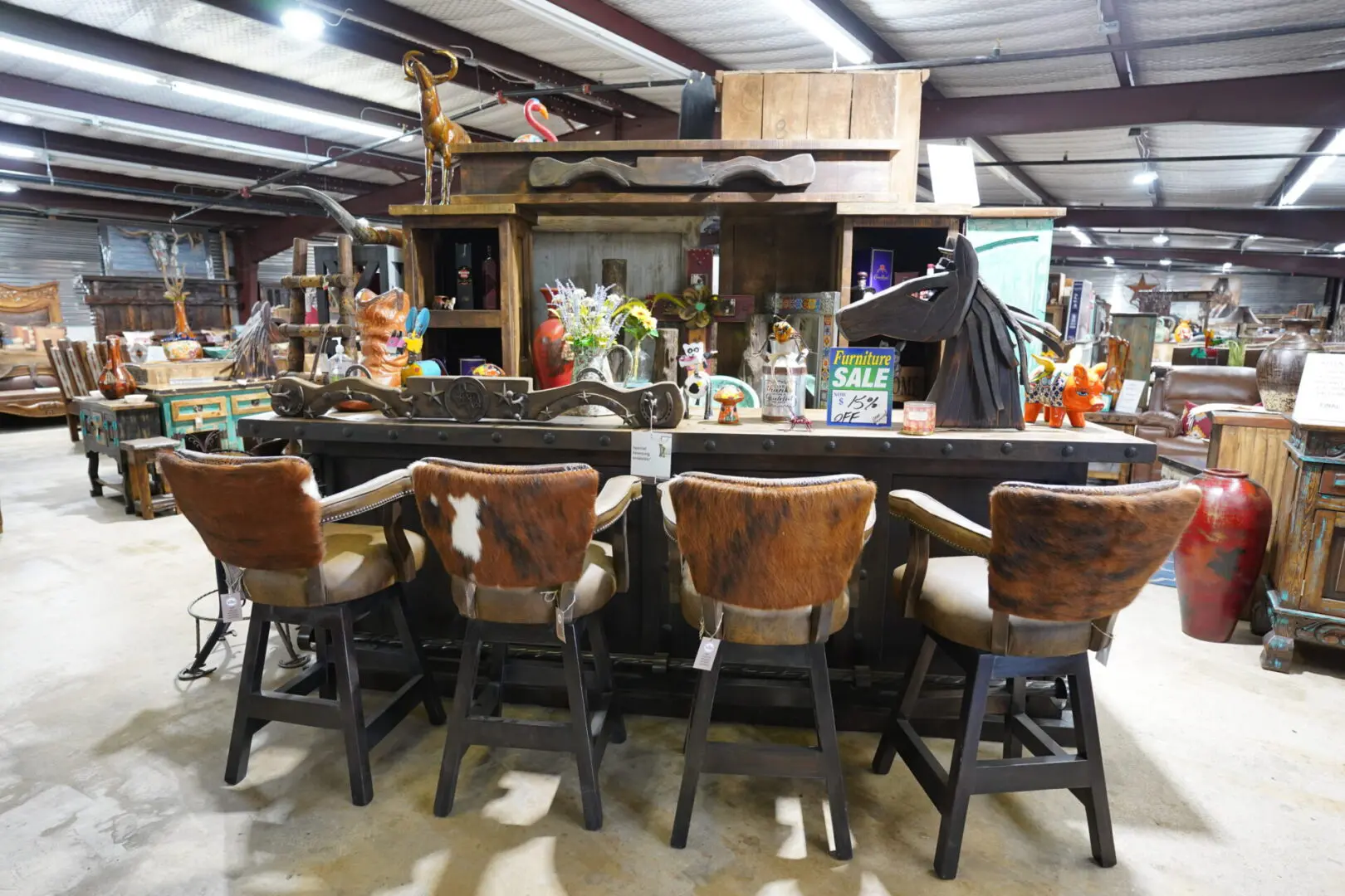 A group of chairs sitting in front of a bar.