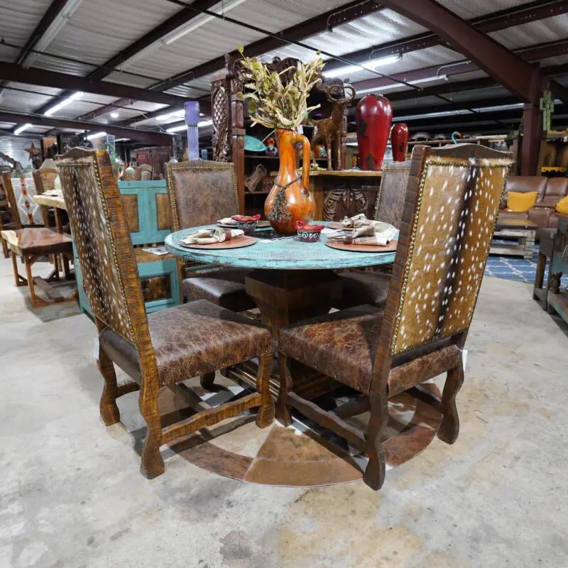 A table and chairs in a room with many tables.