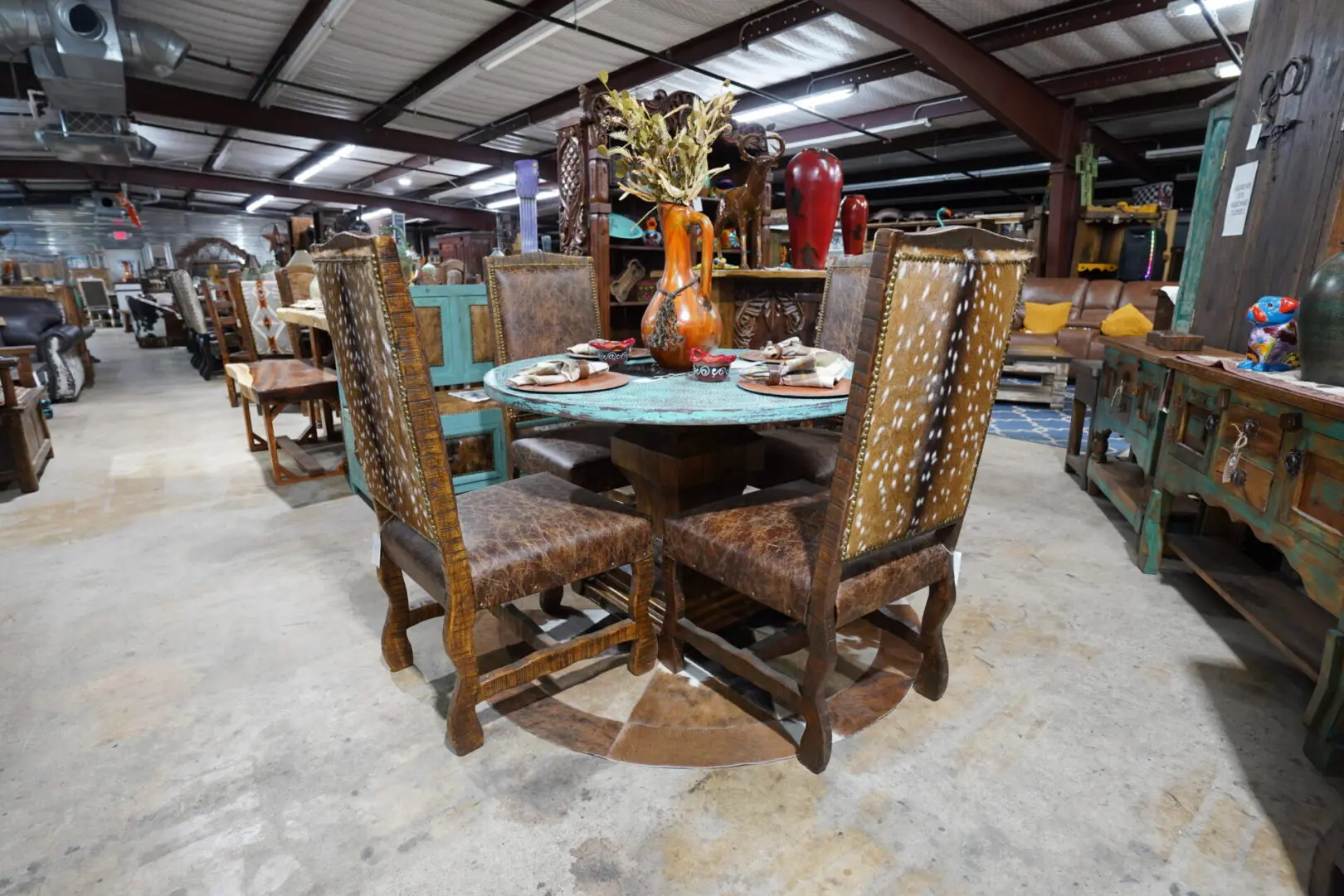 A table and chairs in a room with many tables.