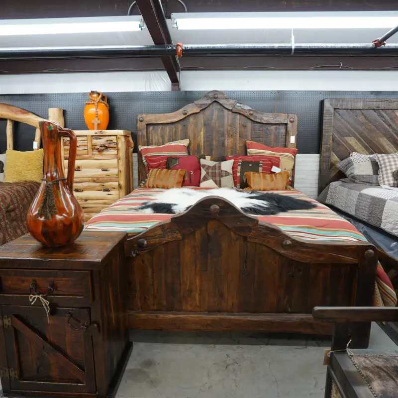 A bed room with many different furniture and items