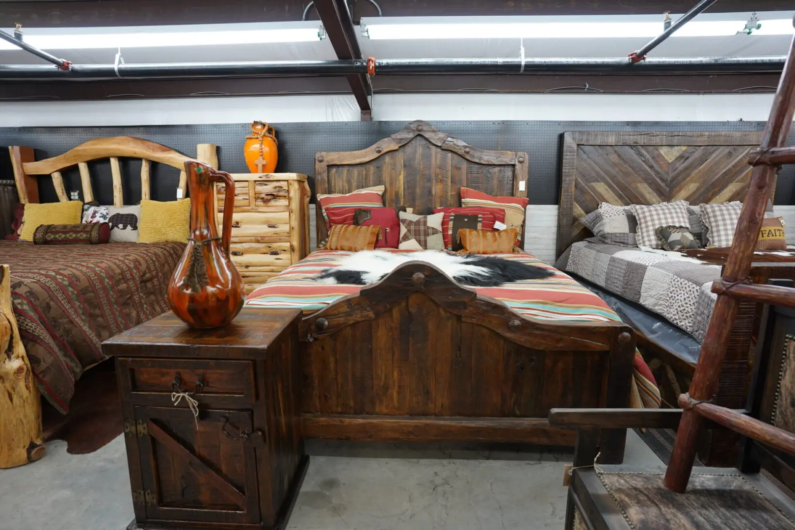 A bed room with many different furniture and items