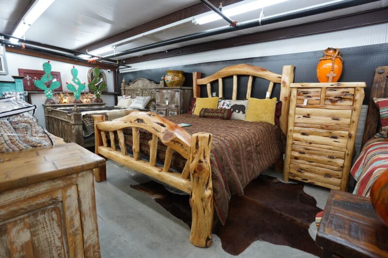 A bed with a wooden headboard and footboard.