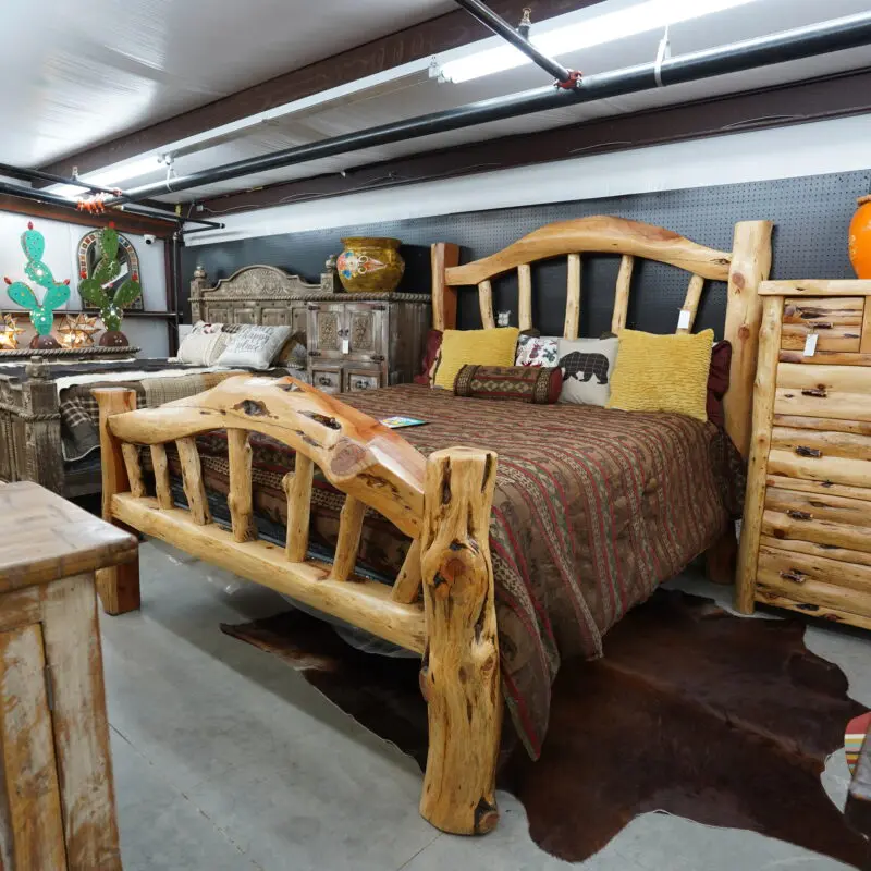 A bed with a wooden headboard and footboard.