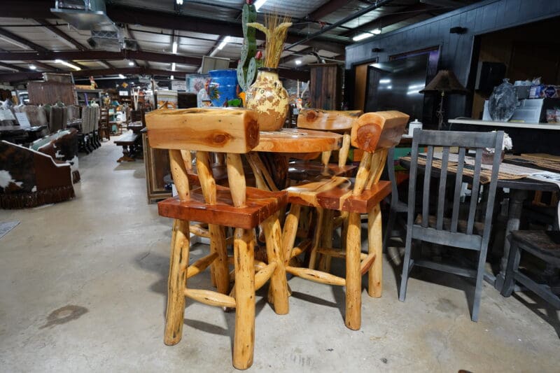 A table and chairs made of wood in a room.