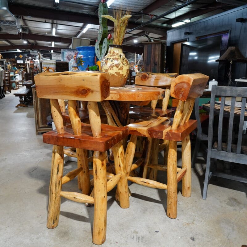 A table and chairs made of wood in a room.