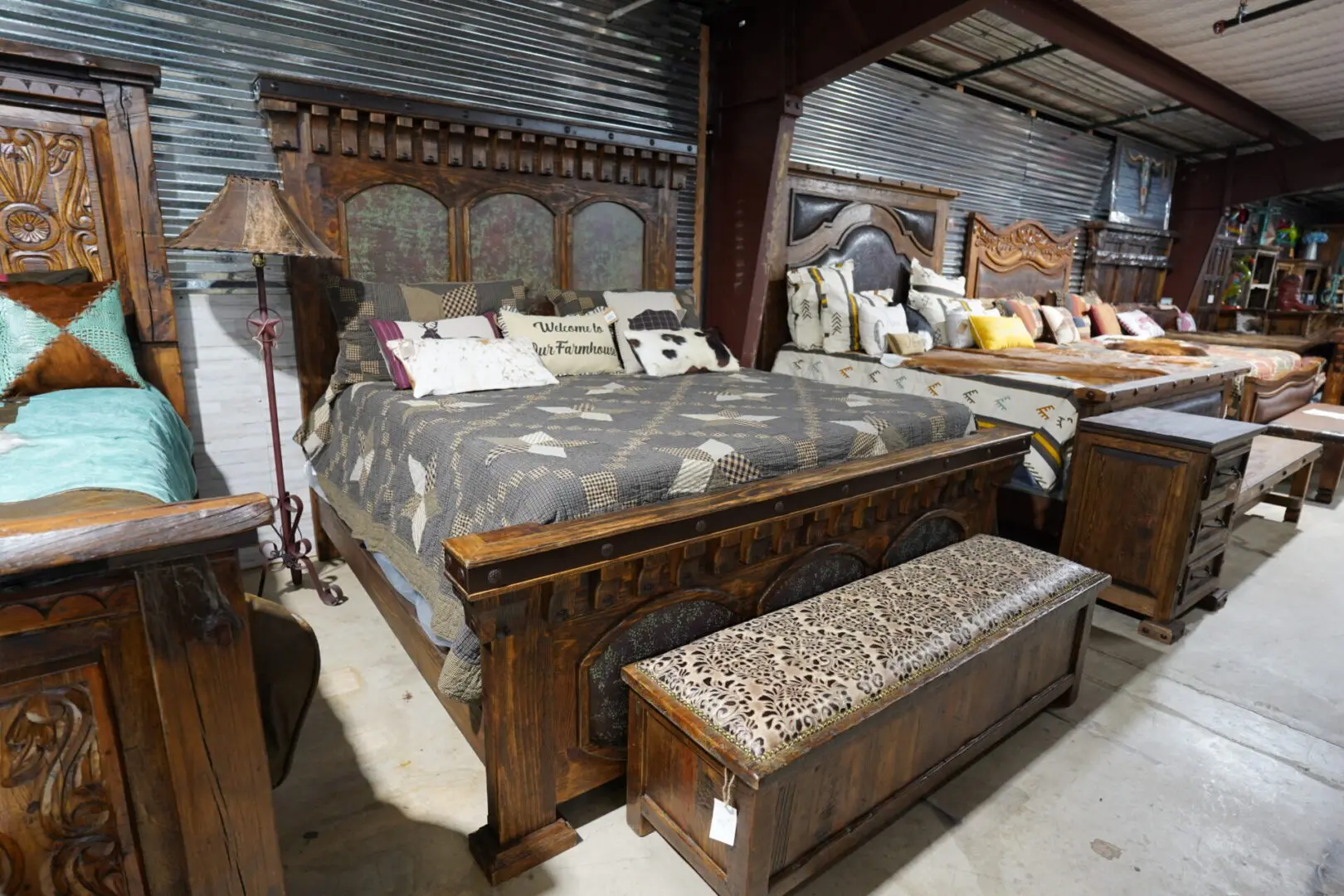 A bed with an ornate headboard and footboard.