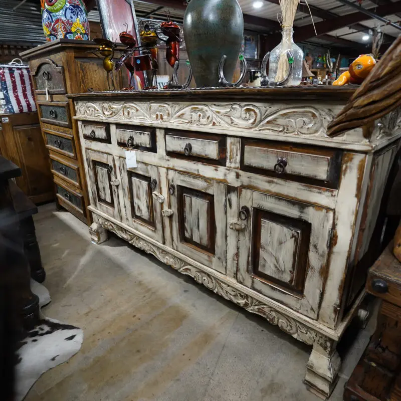 A white cabinet sitting in the middle of a room.