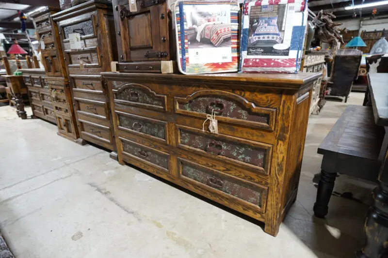 A dresser with six drawers and metal handles.