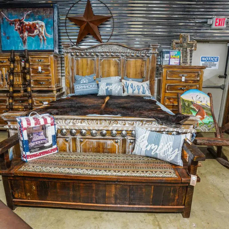 A bed with wooden headboard and footboard.