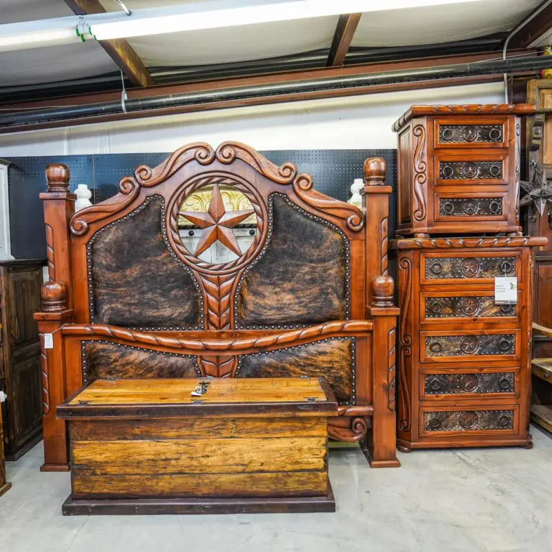 A bed and dresser in a room.