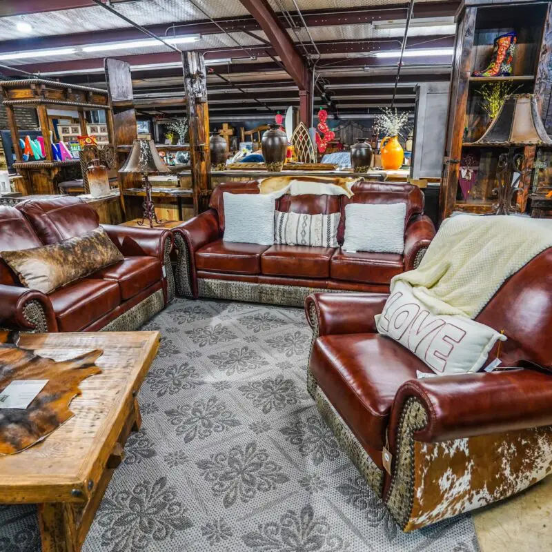 A room filled with lots of leather furniture.