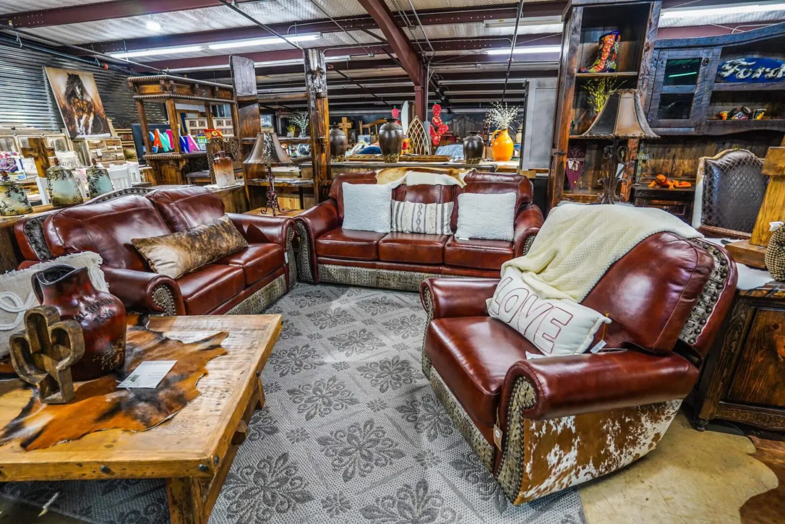 A room filled with lots of leather furniture.