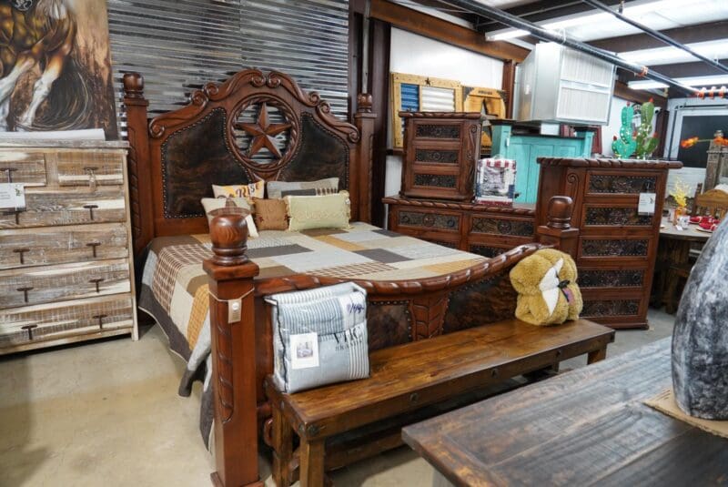 A bed with a wooden headboard and footboard.