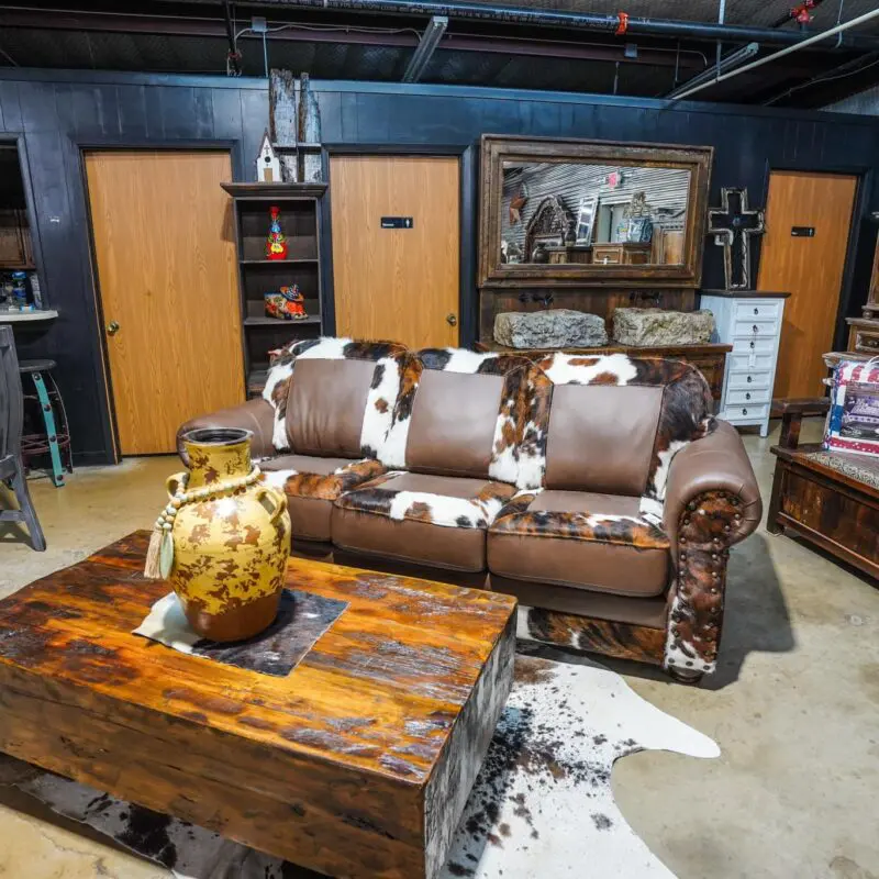 A living room with a couch and coffee table