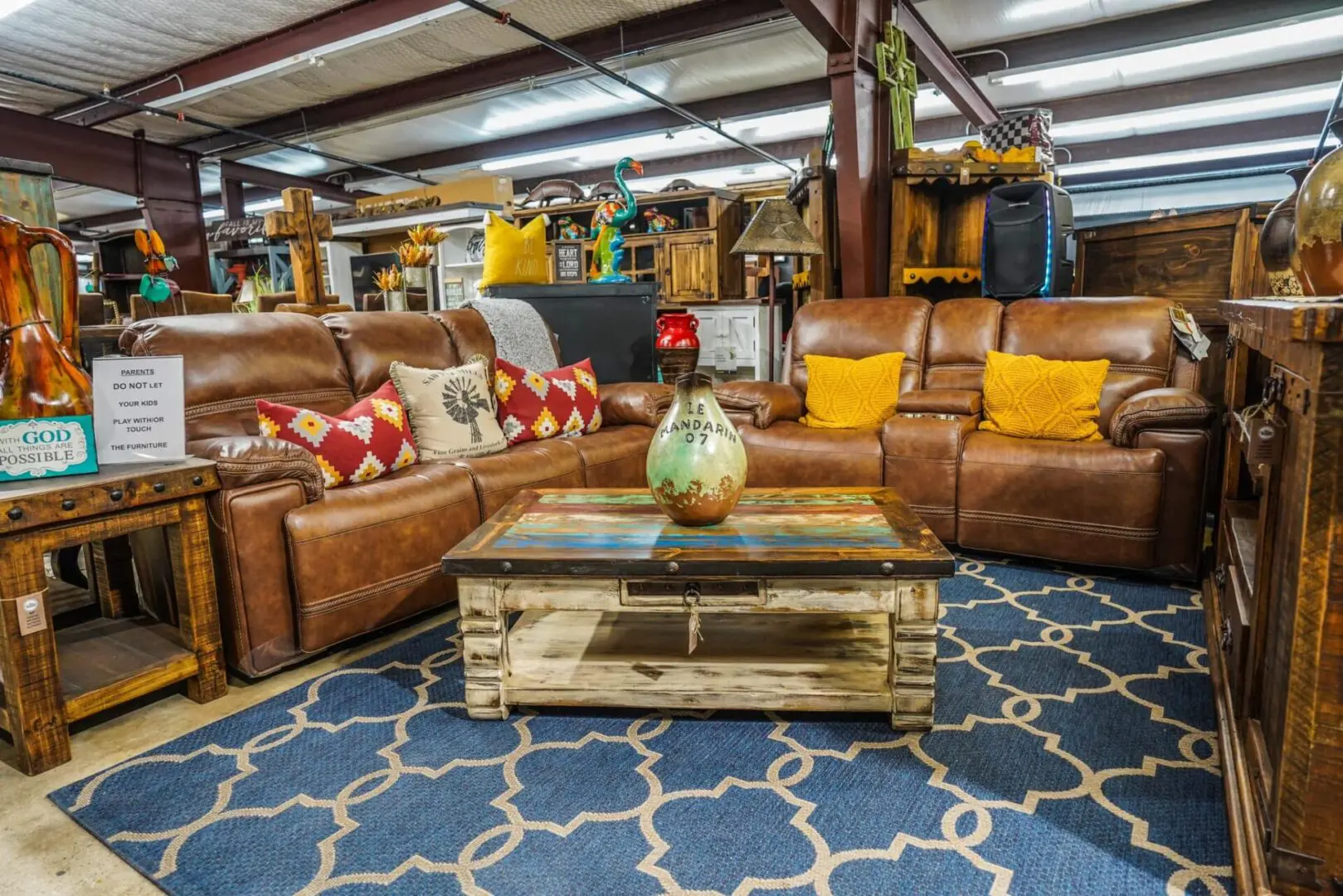 Leather sectional sofa with coffee table and rug.