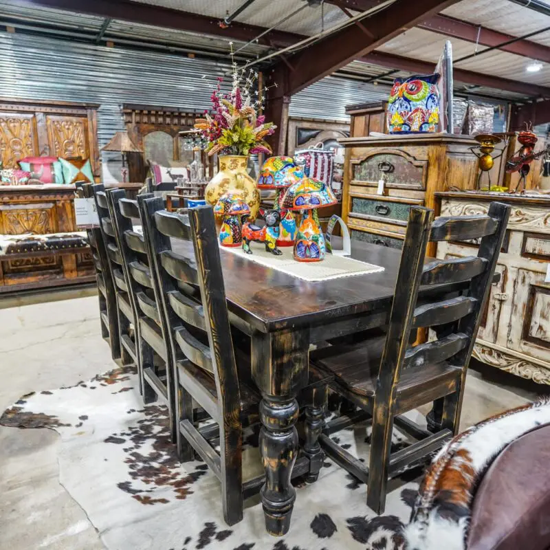 Rustic wood dining set with cowhide rug.