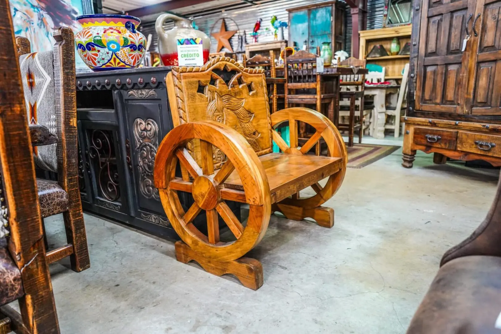 Wooden wagon wheel chair in a shop.