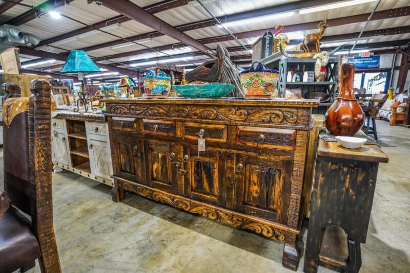 Carved wooden cabinet with ornate details.