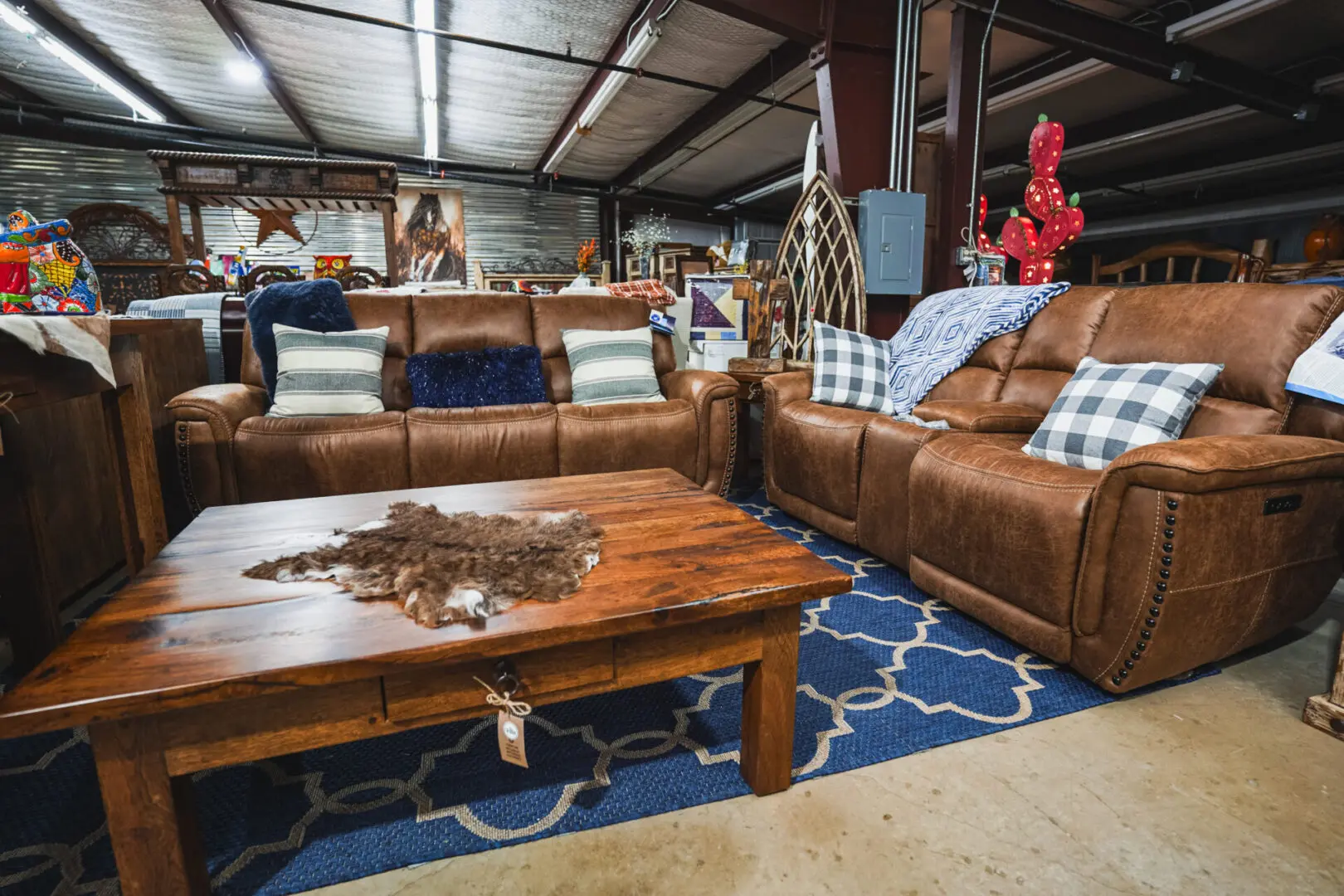 Brown leather sofas with a wood coffee table.