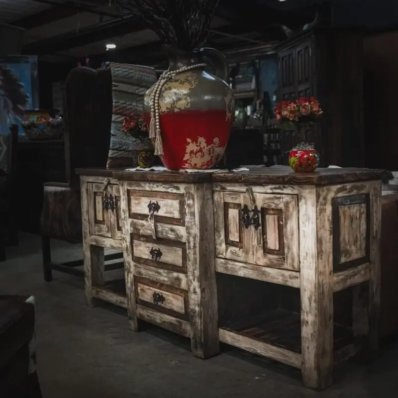 Rustic wooden cabinet with drawers and shelves.