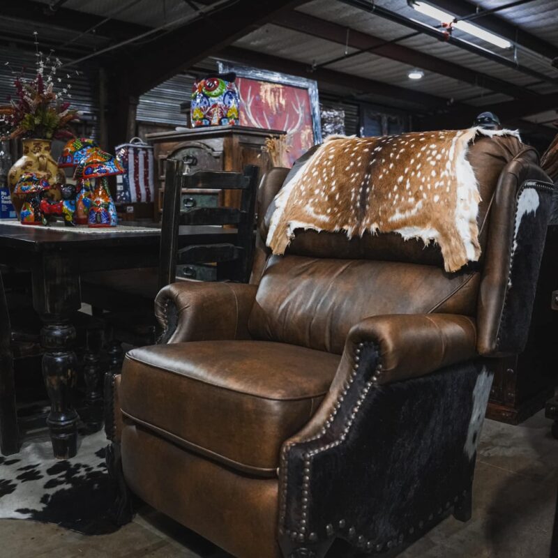 Brown leather recliner with deer hide.