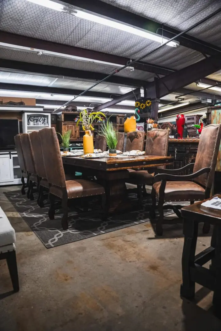 Wooden dining table with leather chairs.