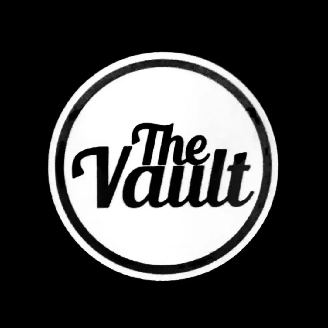 A black and white logo of the vault.