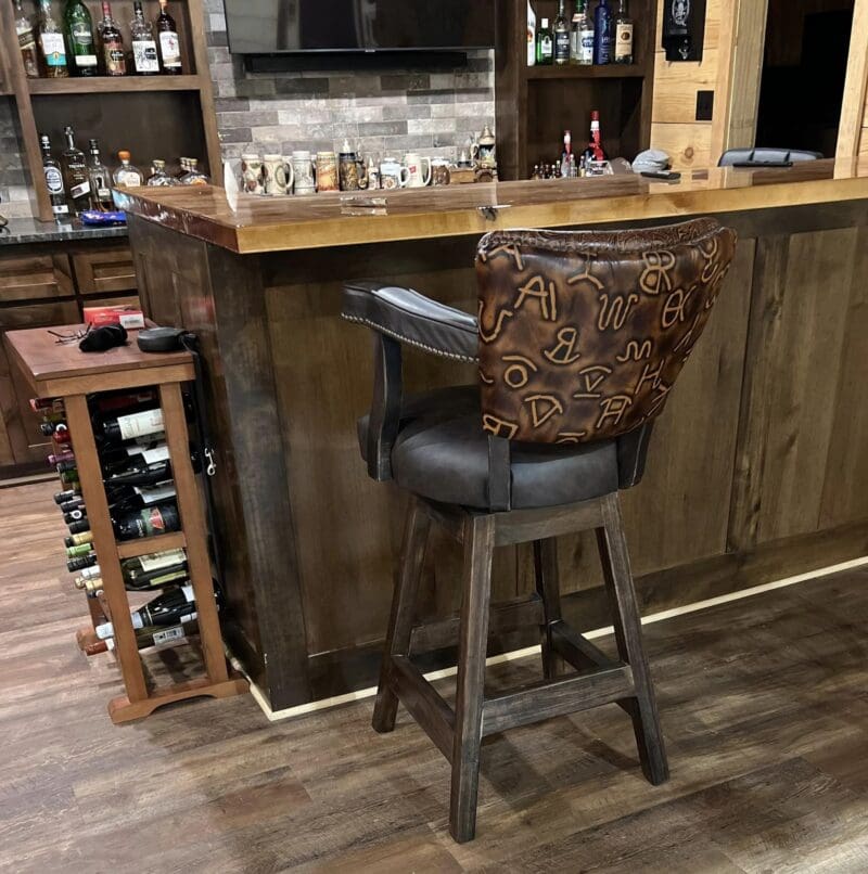 Brown leather bar stool with branding