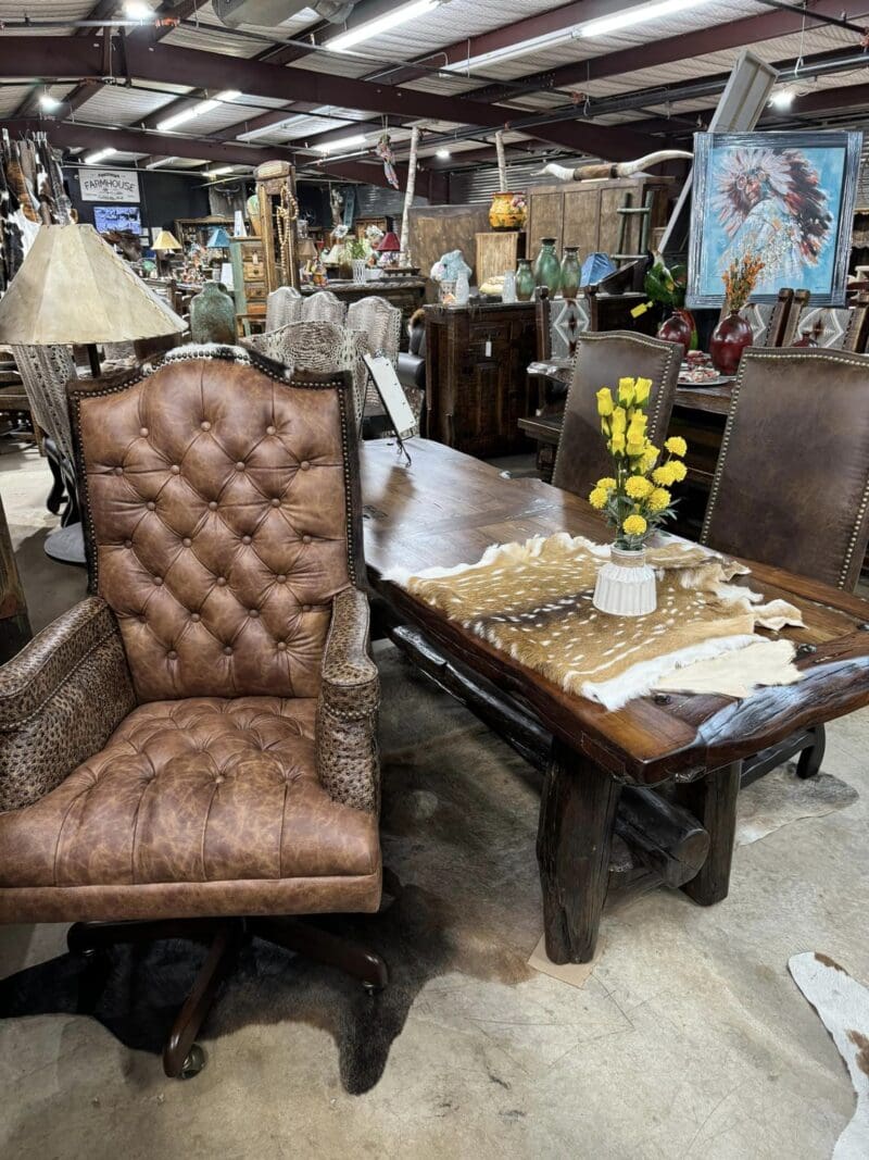 Brown leather chair in rustic dining room.