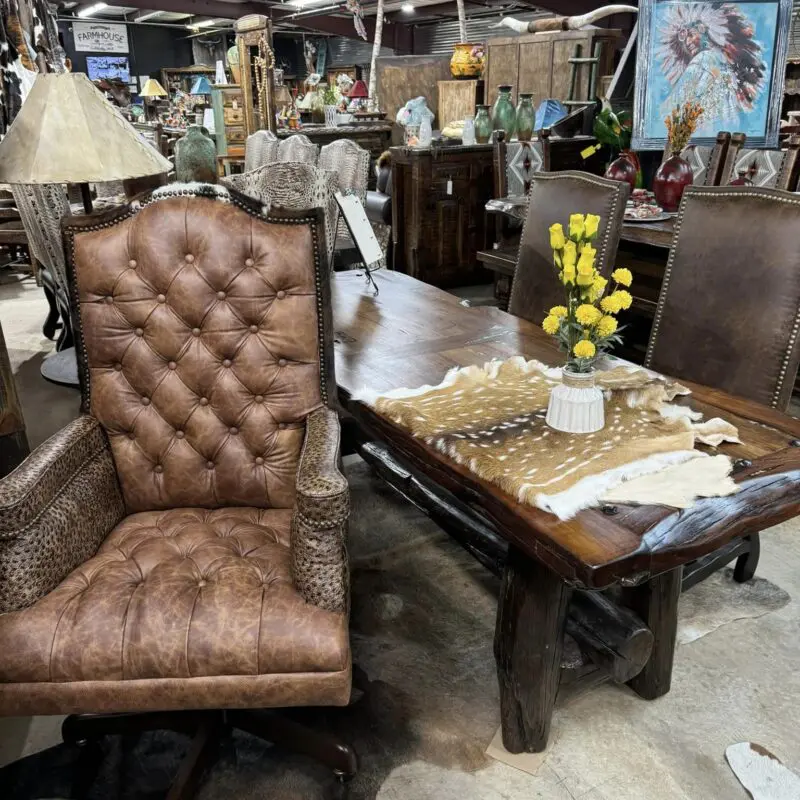 Brown leather chair in rustic dining room.