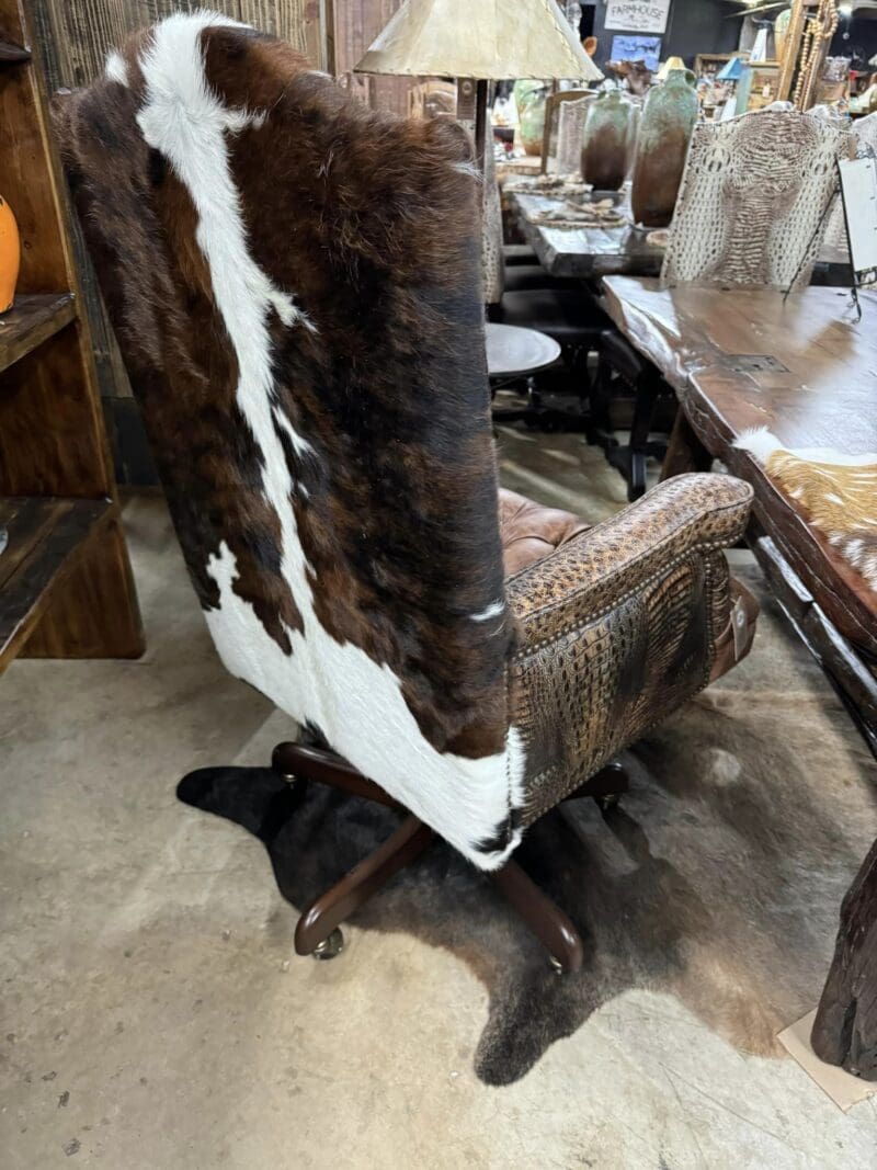 Cowhide office chair on a rug.