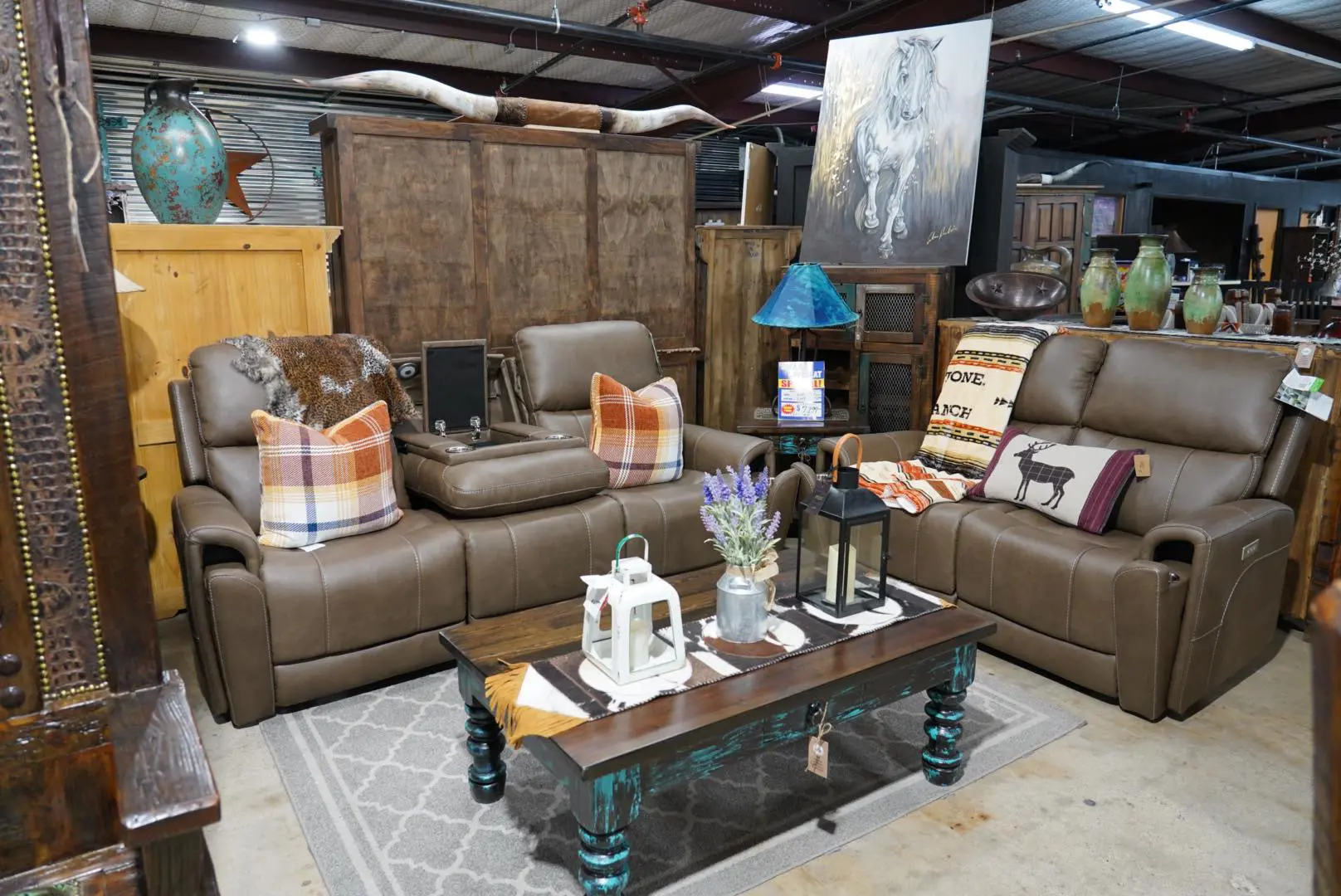 Brown leather reclining sofa in a rustic living room.