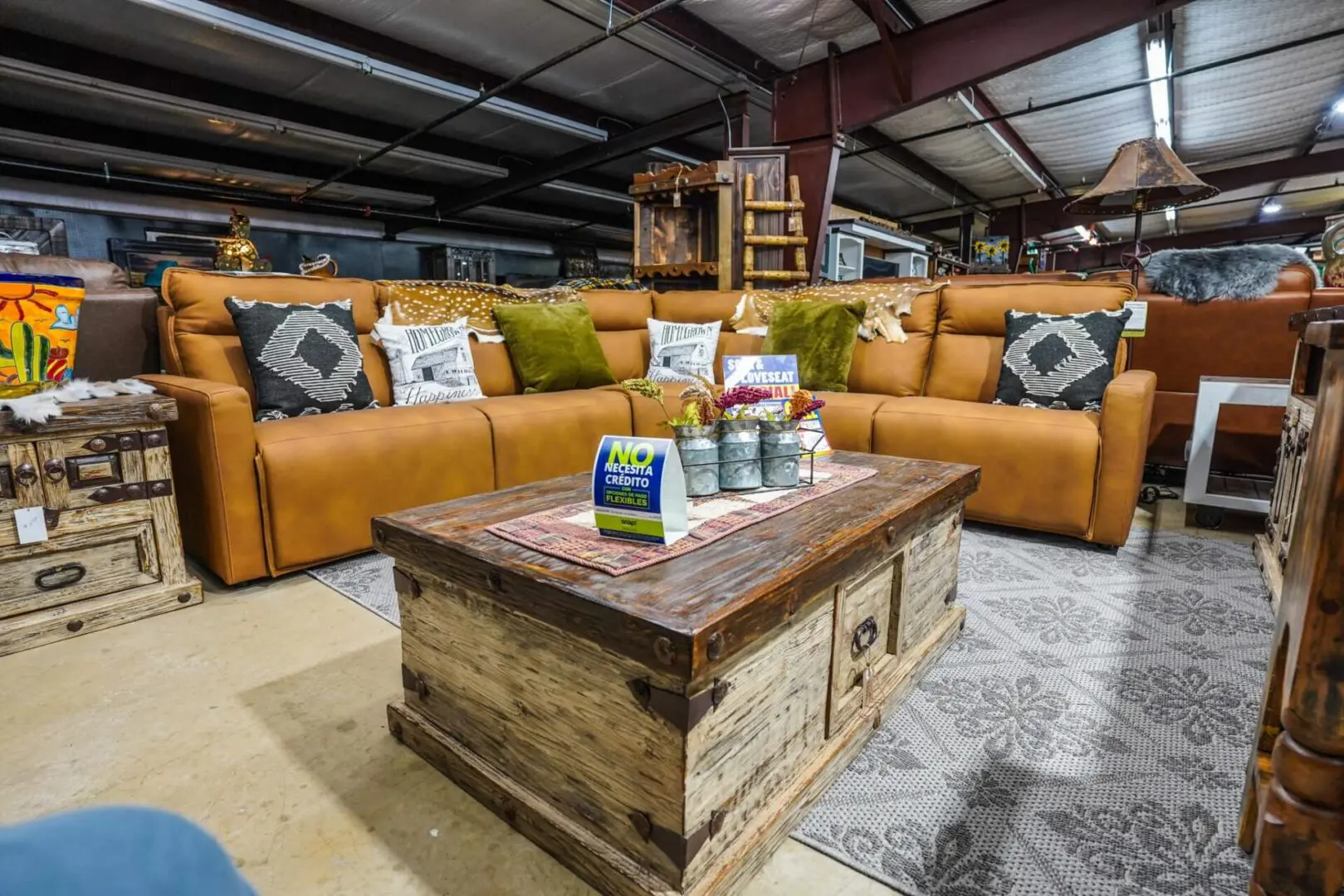 Leather sectional sofa with coffee table and rug.