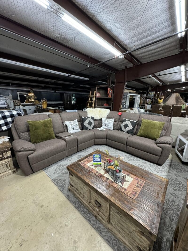 Brown sectional sofa with coffee table.