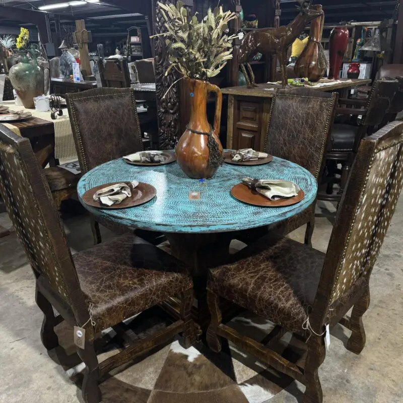 Rustic wooden dining set with leather chairs.